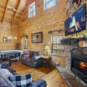 Cabin Rentals Tennessee: Cozy up in the Living room with 2 couches or EZ chair while watching TV or snuggling by the fire place.